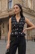 Black polka peplum top
